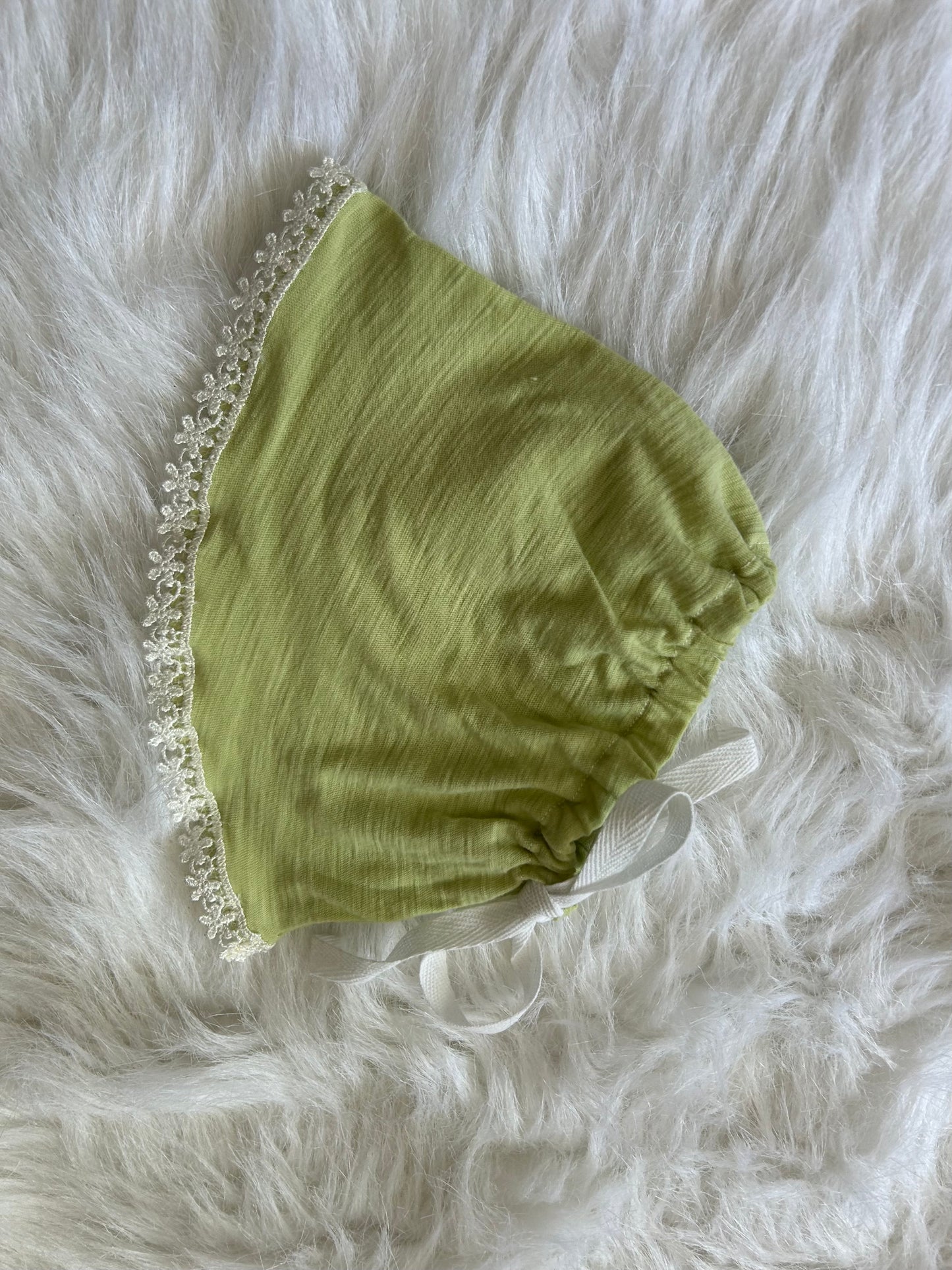 100% cotton lime green with floral trim.