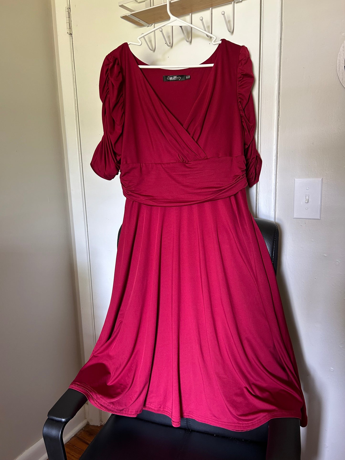 Wine red lace covering and size 14 dress.