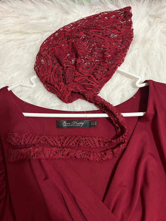 Wine red lace covering and size 14 dress.